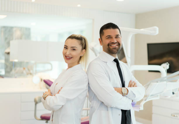 Male and female dentists at the dentist's office hired through a dental staffing agency