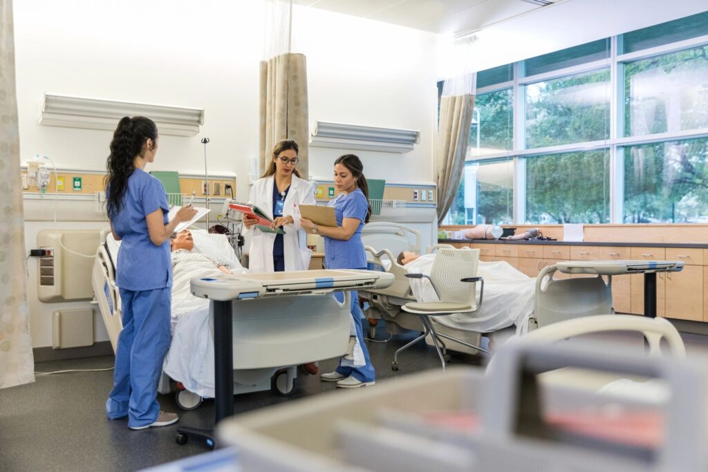 Female hospital trainer helps to repeat instructions so the interns can confirm their notes are correct